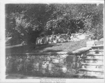 Photograph by R.P. Conklin of “Steps of Old Bank Buillding Garden Plot. Note boy sitting on wall. Circa 1900. chs-000112
